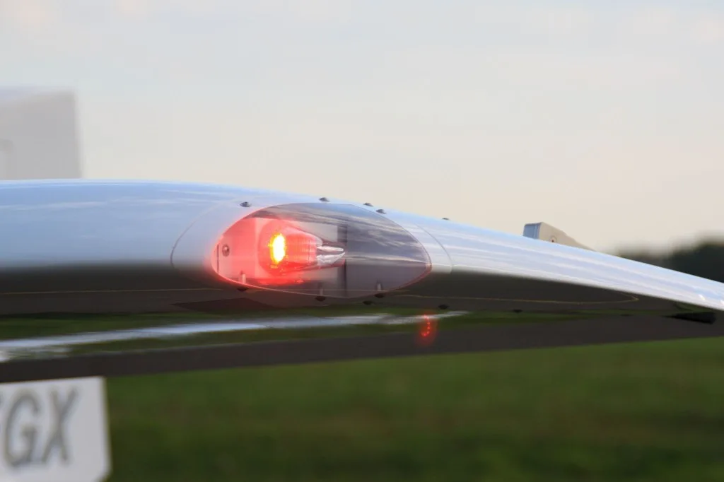 Close-up of the wingtip light on a REMOS GX aircraft.