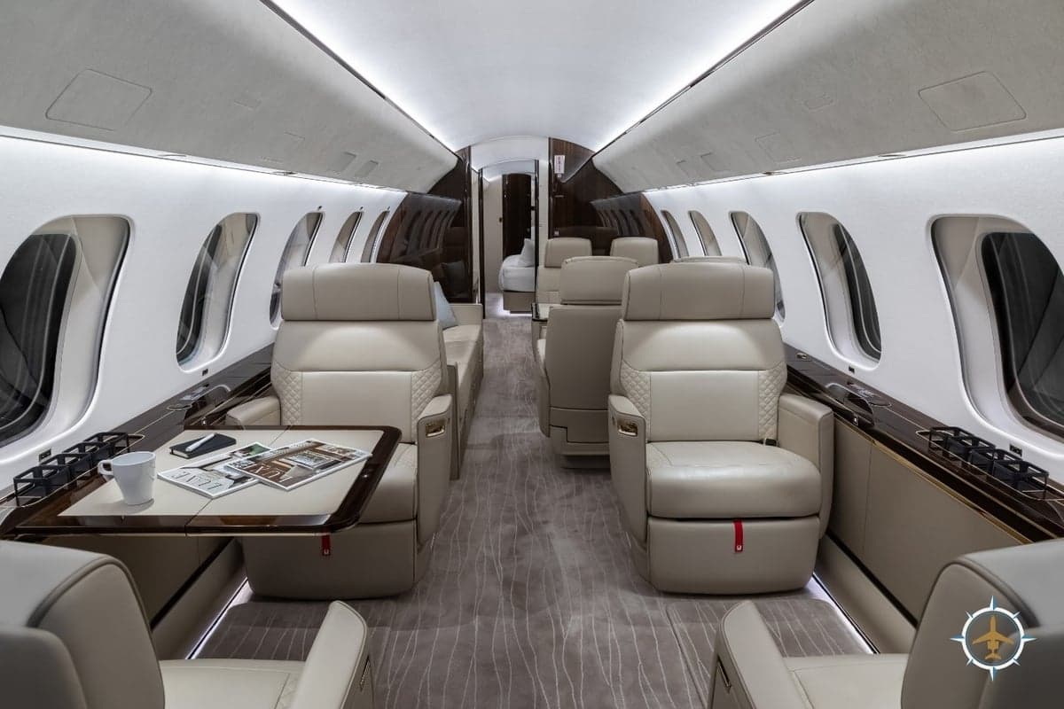 The interior of a Bombardier Global Express aircraft features luxurious seating and amenities.