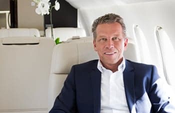 Man sitting in the cabin of an aircraft.
