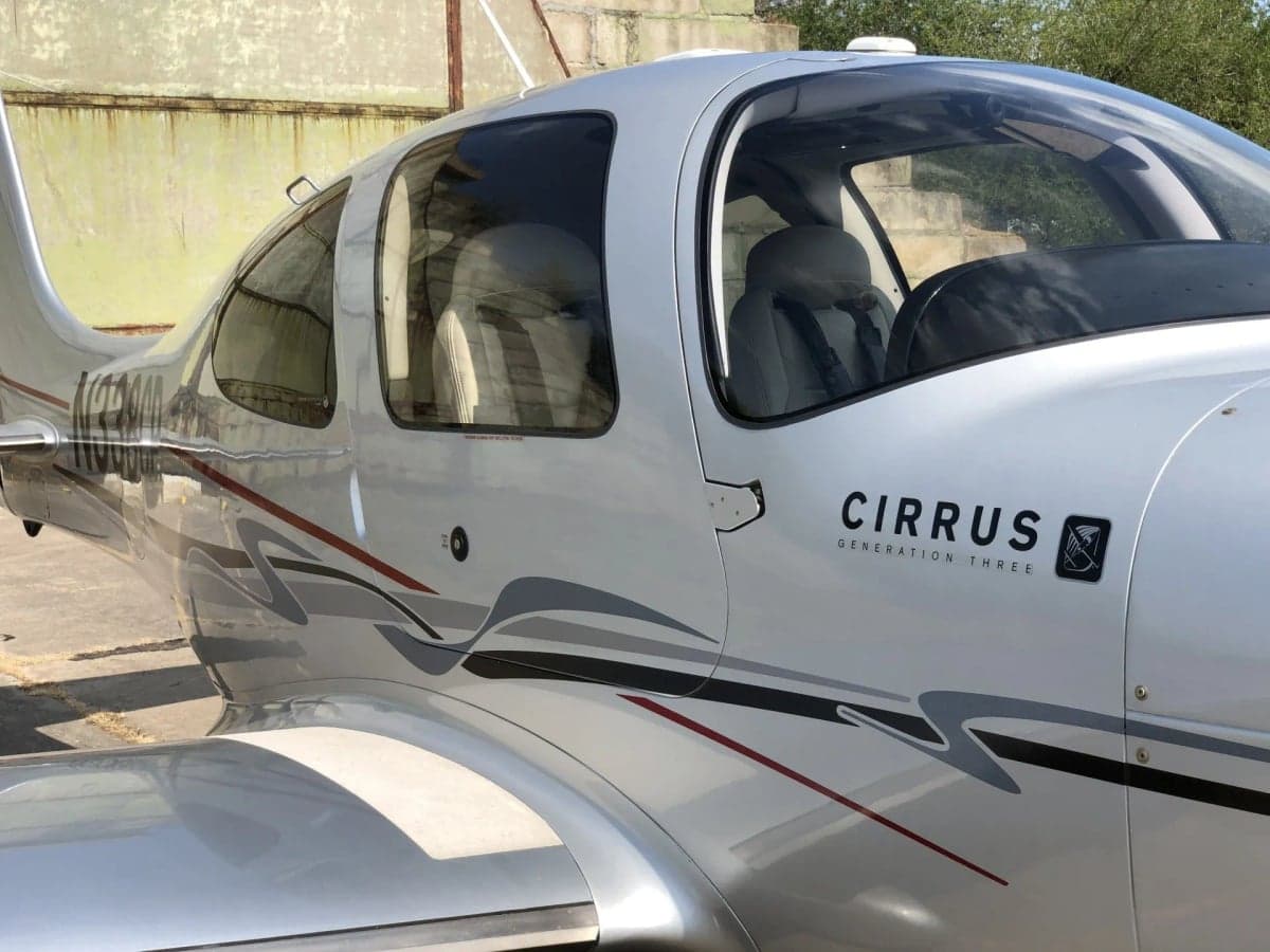 Side view of the Cirrus SR22T with registration N338CP.