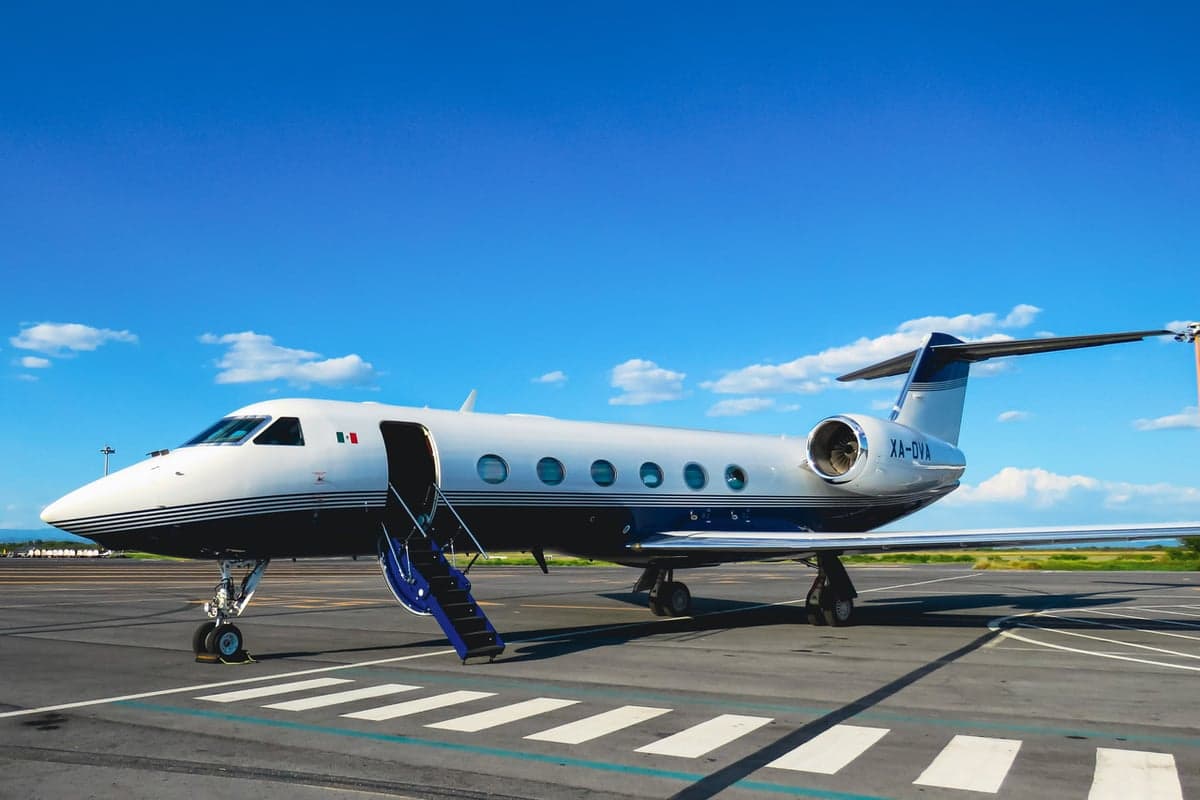 XA-OVA aircraft parked on the tarmac with stairs extended.