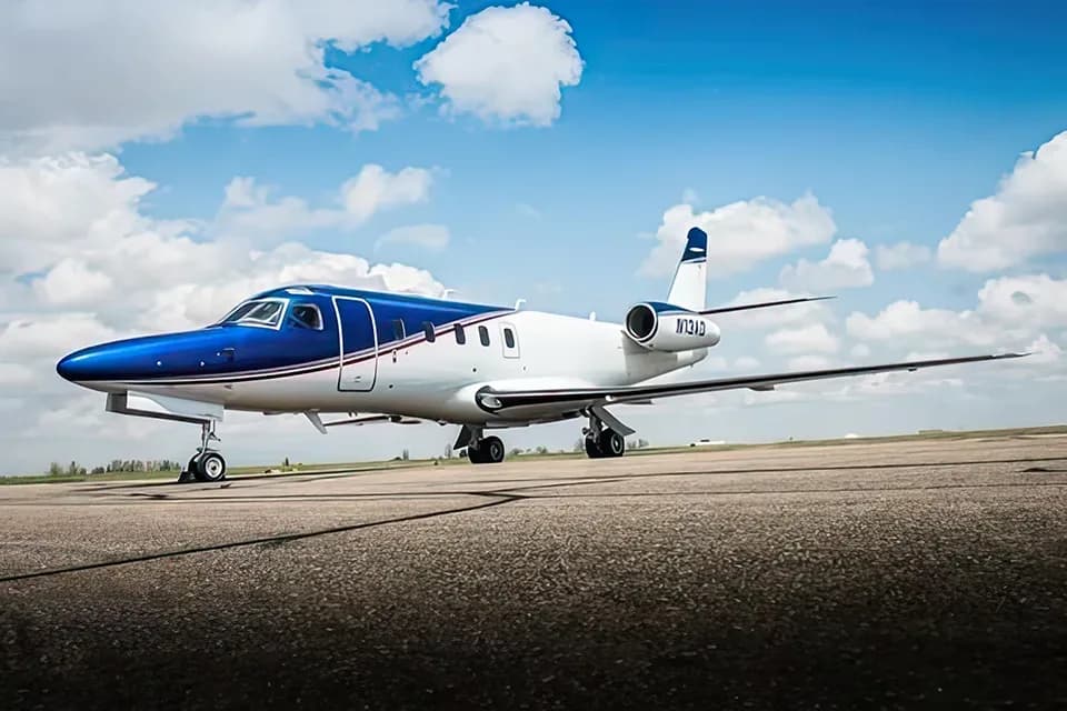 Cessna Citation CJ3 on the tarmac with blue and white paint scheme.