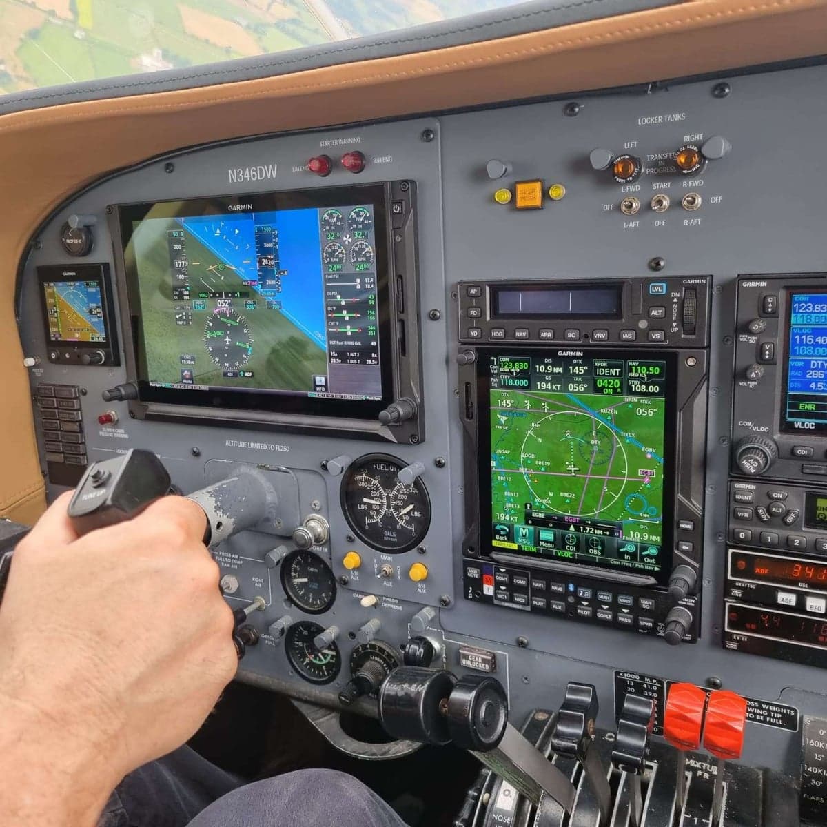Close-up of the Cessna 414 Chancellor cockpit avionics during flight.