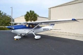 Cessna 172 Skyhawk aircraft N6822M parked on the tarmac with a blue and white paint scheme.
