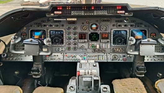 The instrument panel of the Learjet aircraft is shown.