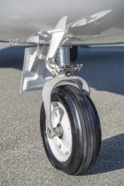 A close-up of the tail and engine of a Cessna Citation CJ1+ aircraft, showing the registration number.