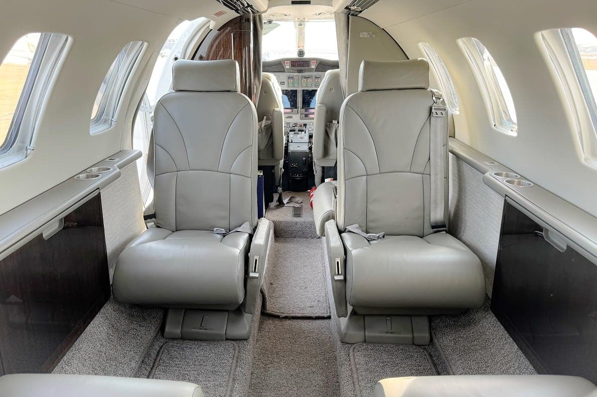View of the interior of a Cessna Citation CJ3+ aircraft, showing the leather seats and cockpit.