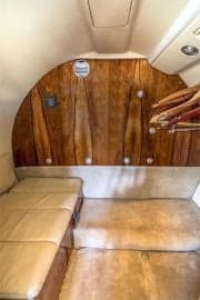 The interior of a Cessna Citation CJ1+ aircraft, showing the seating arrangement and cabin details.