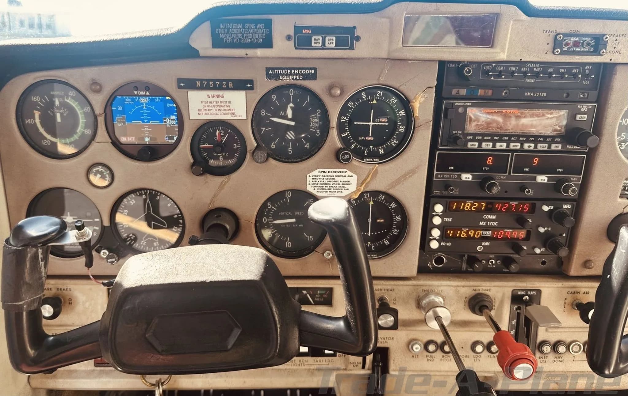 Close-up view of the Cessna 152 cockpit instrument panel with various gauges and avionics.