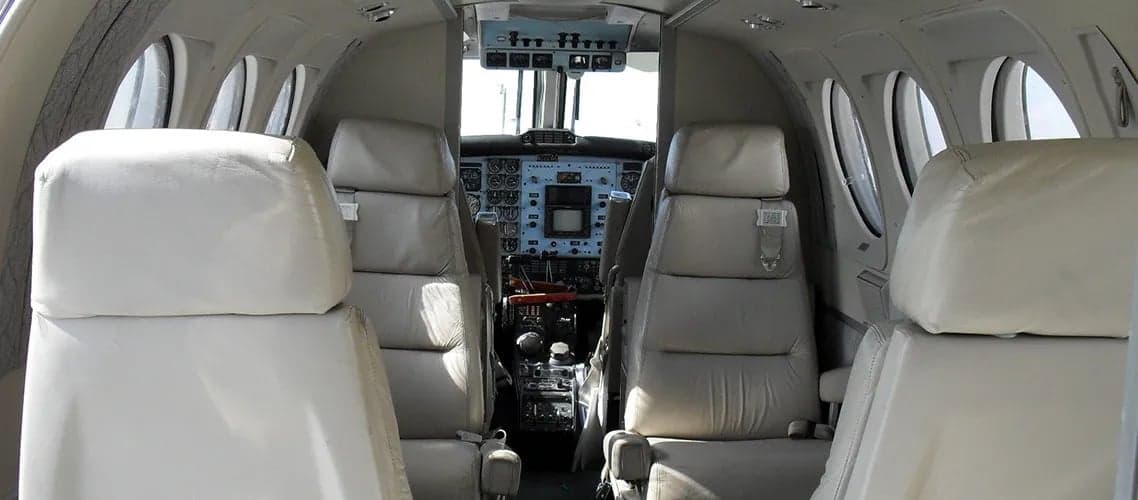 View of the cabin and cockpit of a Beechcraft King Air.