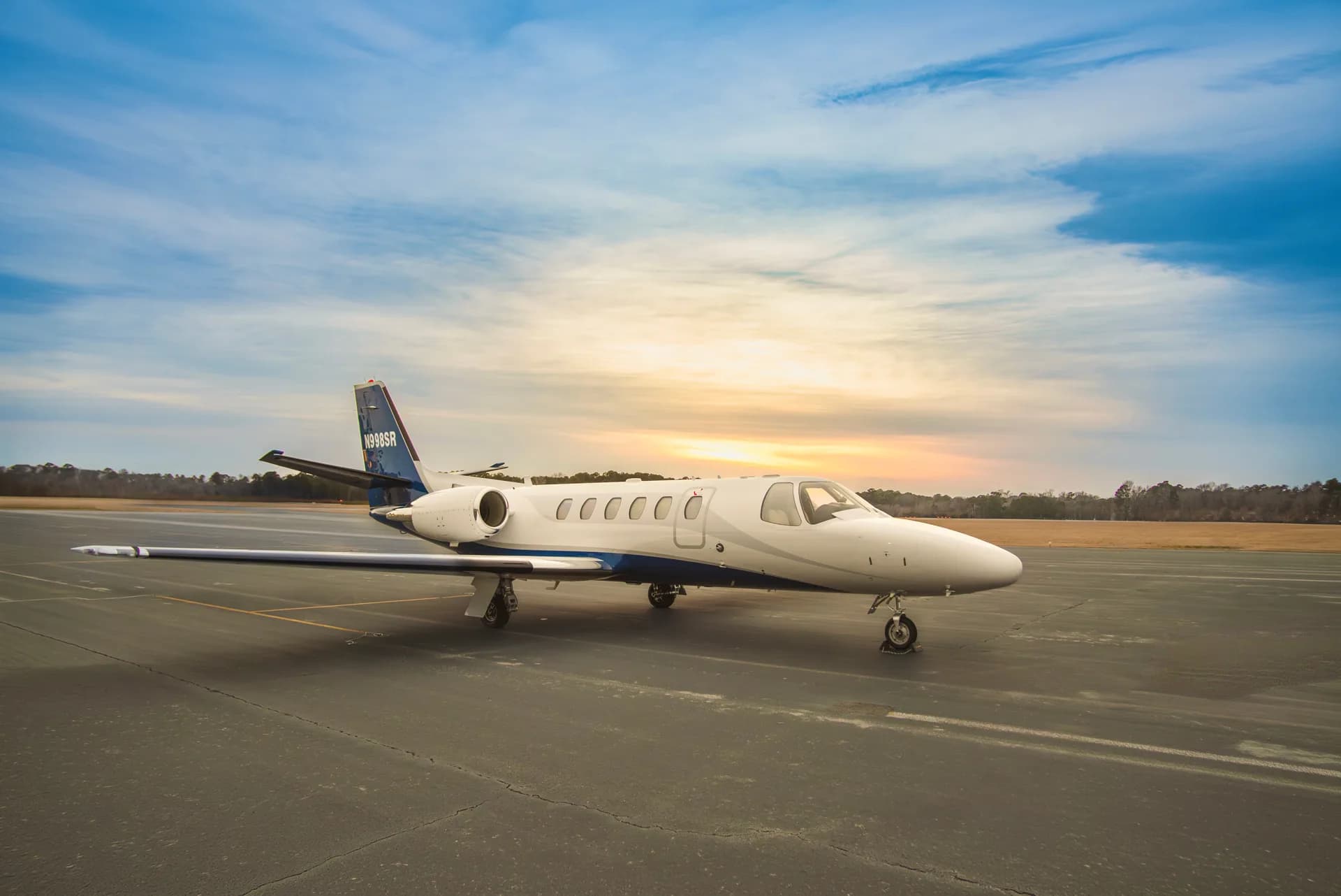 A Citation Bravo aircraft with tail number N998SR is parked on the tarmac.