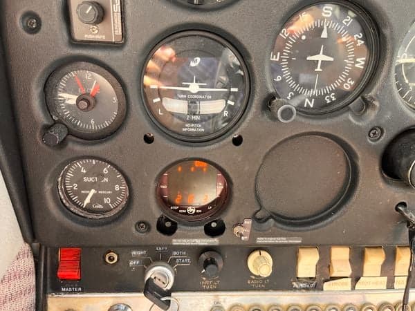 A close-up of the instrument panel in the cockpit of the aircraft N2680F.