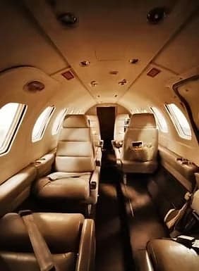 Interior view of a Cessna Citation CJ4 cabin with leather seats.