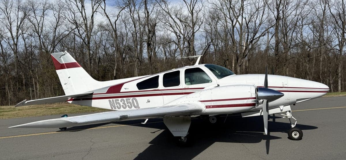 N535Q Beechcraft on the tarmac with a white and maroon paint scheme.