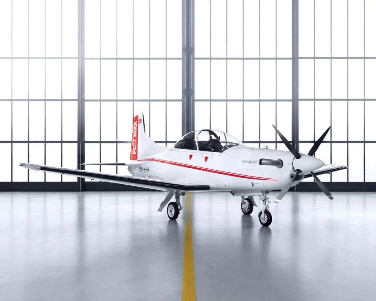 A Pilatus PC-7 MKX aircraft parked in a hangar.