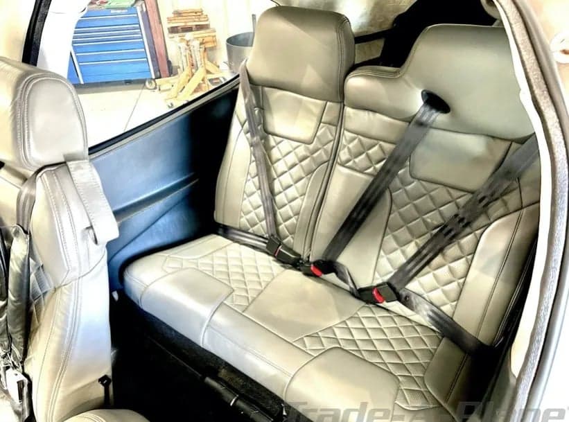 View of the rear seats in the aircraft's cabin.
