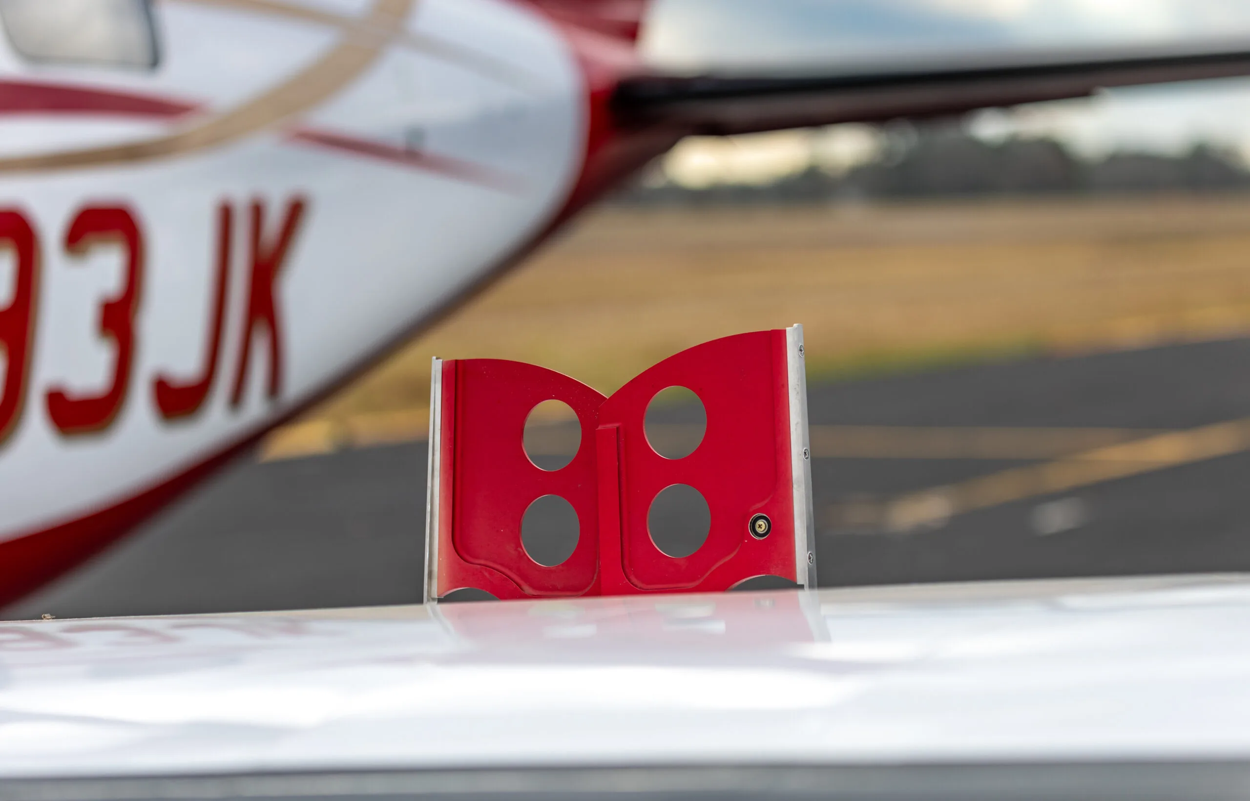 Close-up of the wing and registration number N393JK on the Piper Mirage.