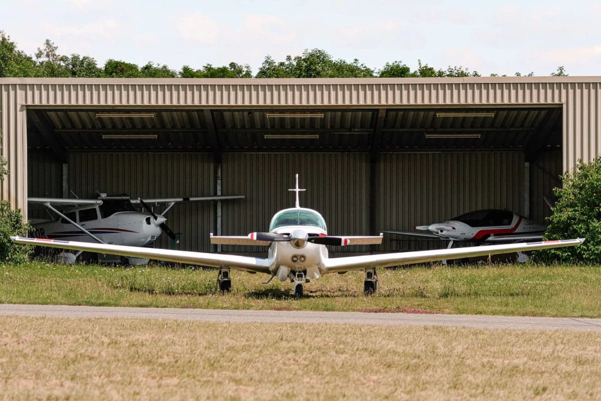 Mooney M20J aircraft D-EIFJ parked on the grass.