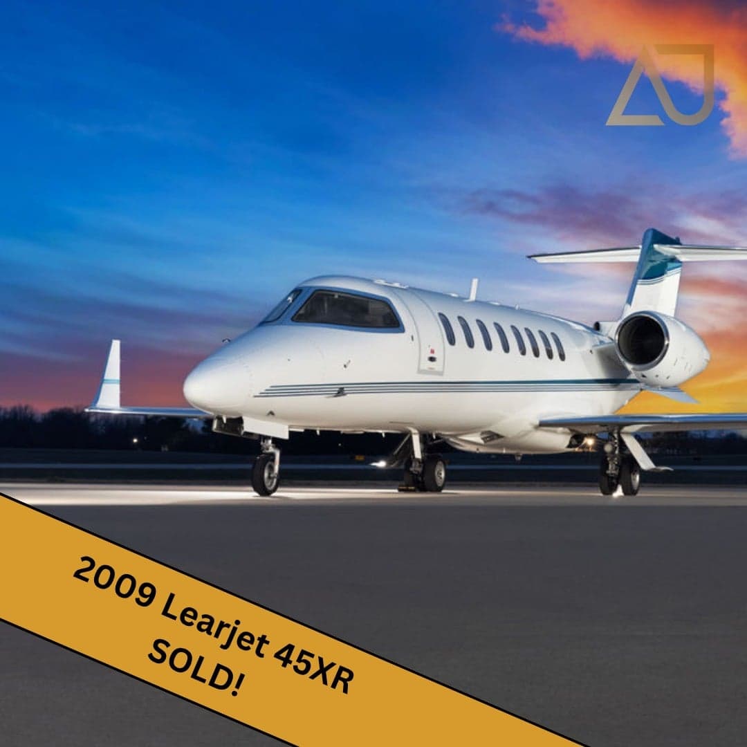 A 2009 Learjet 45XR aircraft is parked on the tarmac with a 'SOLD' banner overlay.