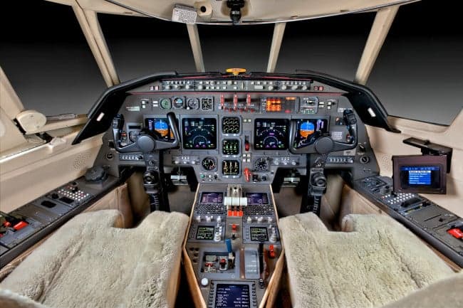 The cockpit of the Falcon 2000 features a full instrument panel and dual control sticks.