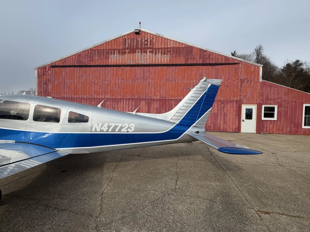Close-up of the tail section of a Piper PA-28-181 Archer II aircraft with registration N47723.