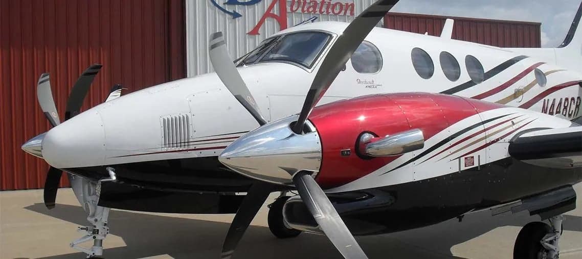 Close up of the nose and propellers of a Beechcraft King Air.