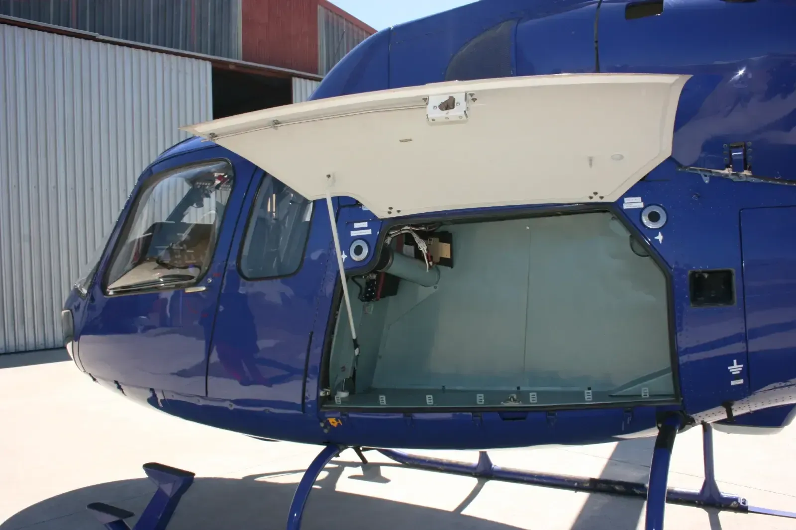 Close-up of the helicopter's nose with an open compartment.