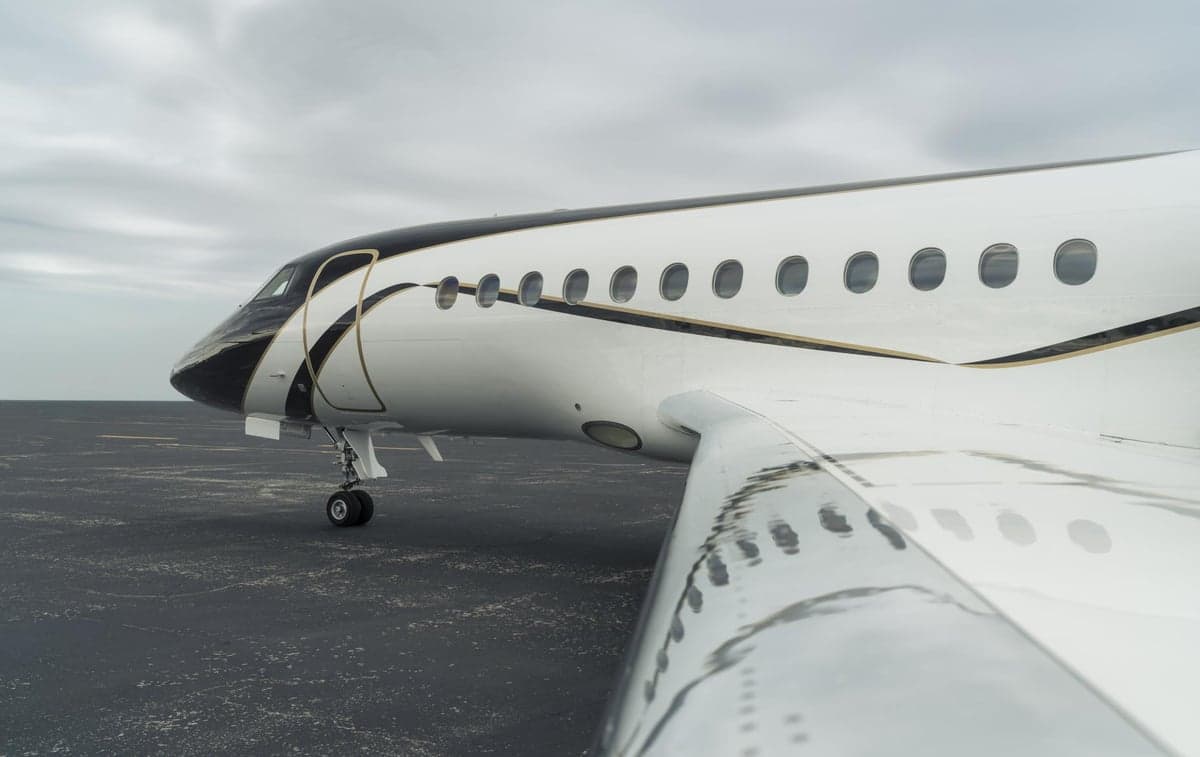 Close up of the fuselage and wing of the Falcon N608LC.