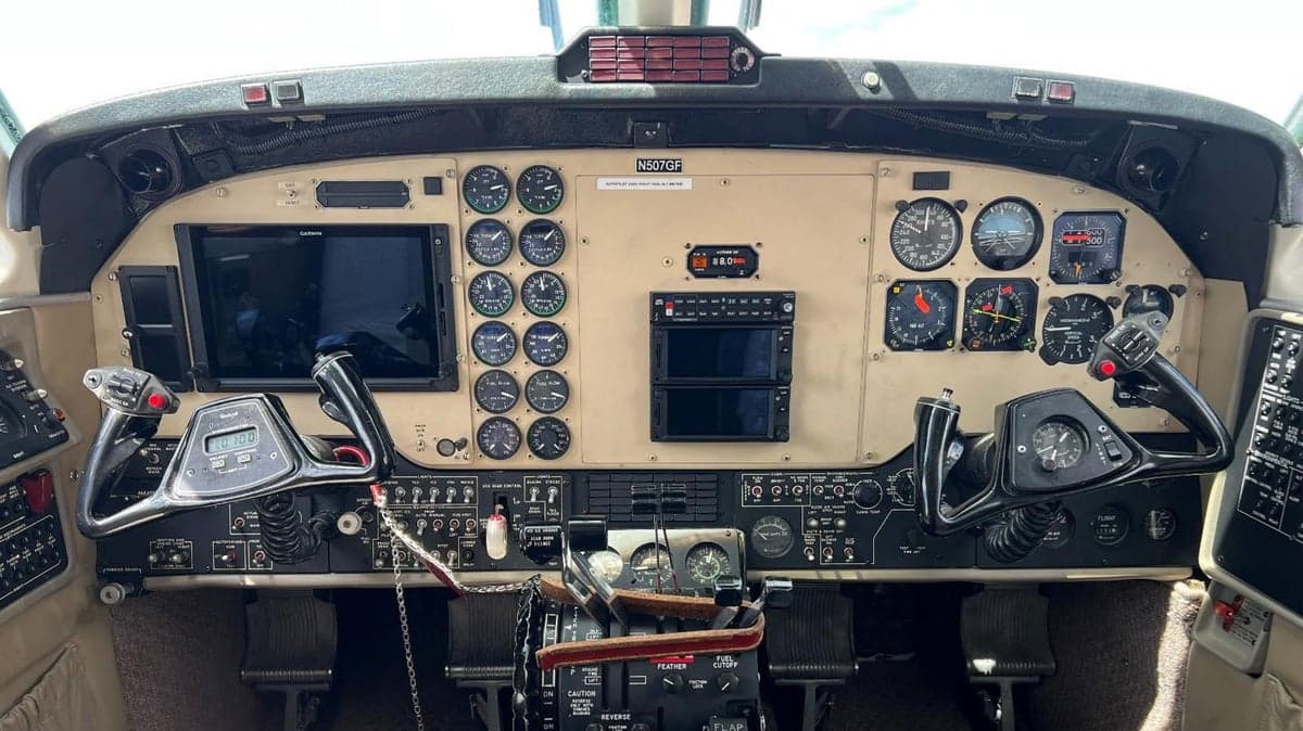 View of the Beechcraft King Air cockpit with instrument panel and controls.