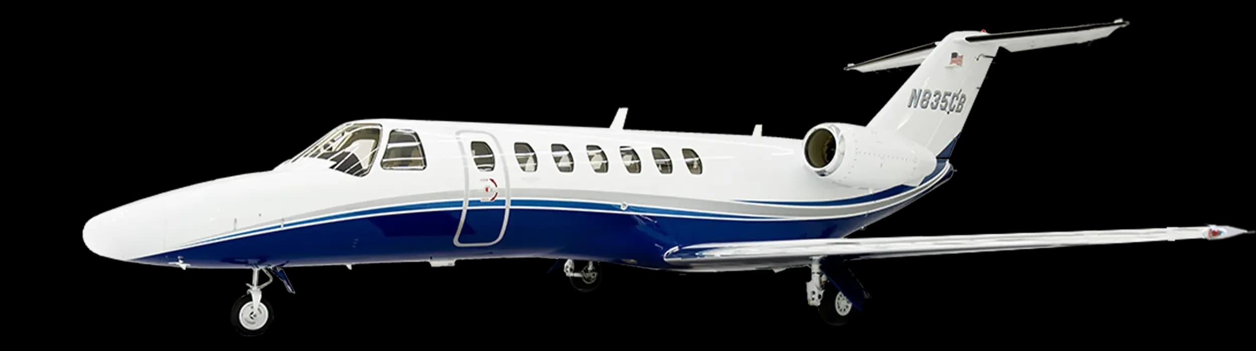 A white and blue Cessna Citation CJ3 business jet, registration N835CB, viewed from the front-left side on a white background.