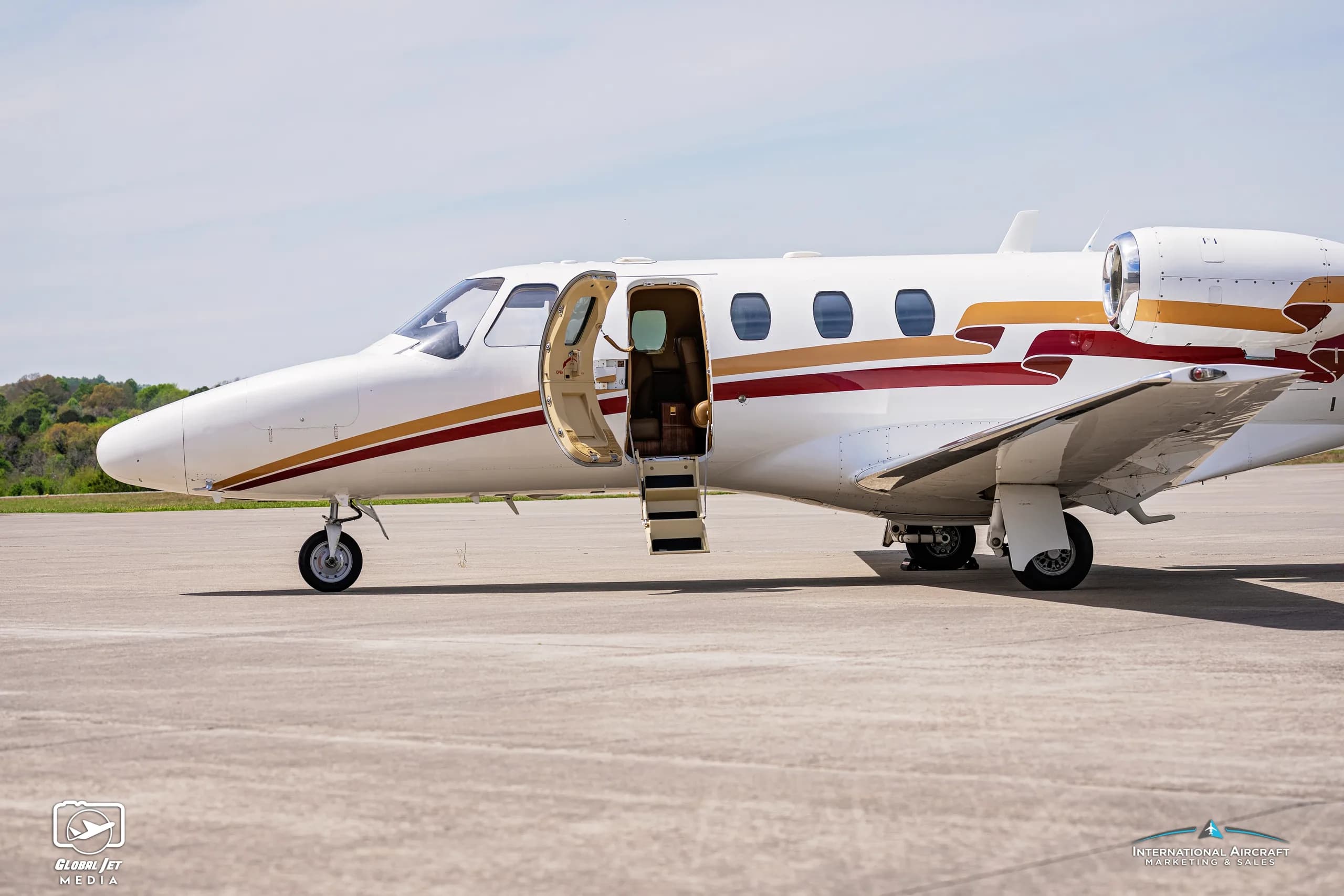 Cessna Citation CJ1 with registration N525TF with the door open.