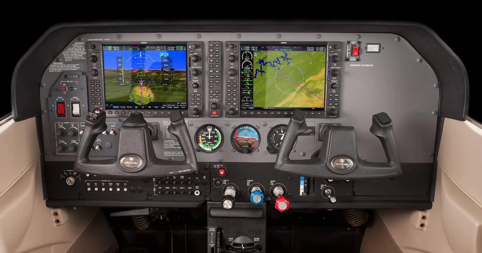 The instrument panel of a Cessna 206 Stationair, featuring dual Garmin G1000 NXi displays and traditional flight controls.