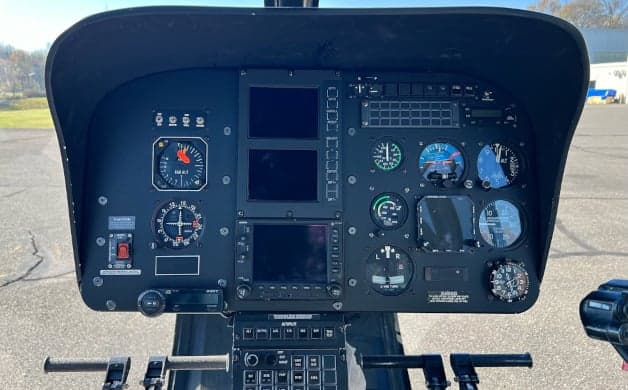 Interior view of the helicopter cabin and cockpit.