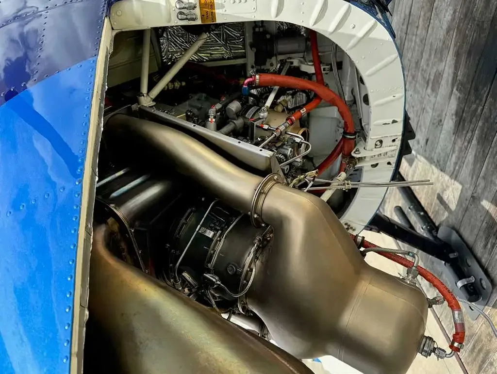 A detailed view of the engine and internal components within the open compartment of the MD 530 helicopter.