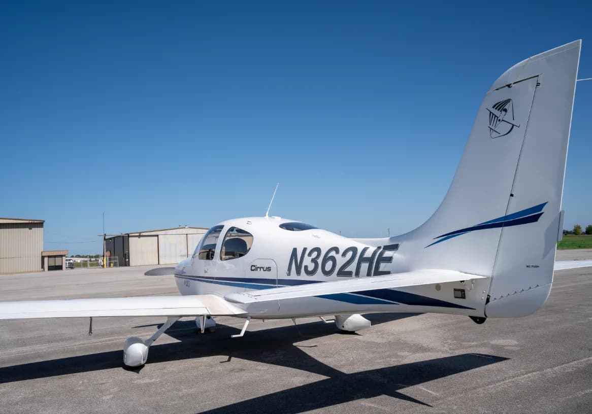 The tail of a Cirrus SR20 aircraft with the registration number N362HE.