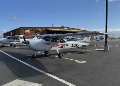 Cessna 172 Skyhawk N15MJ parked on the tarmac.
