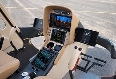 Close-up of the helicopter cockpit instrument panel.