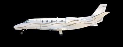 Side view of a white and red private jet.