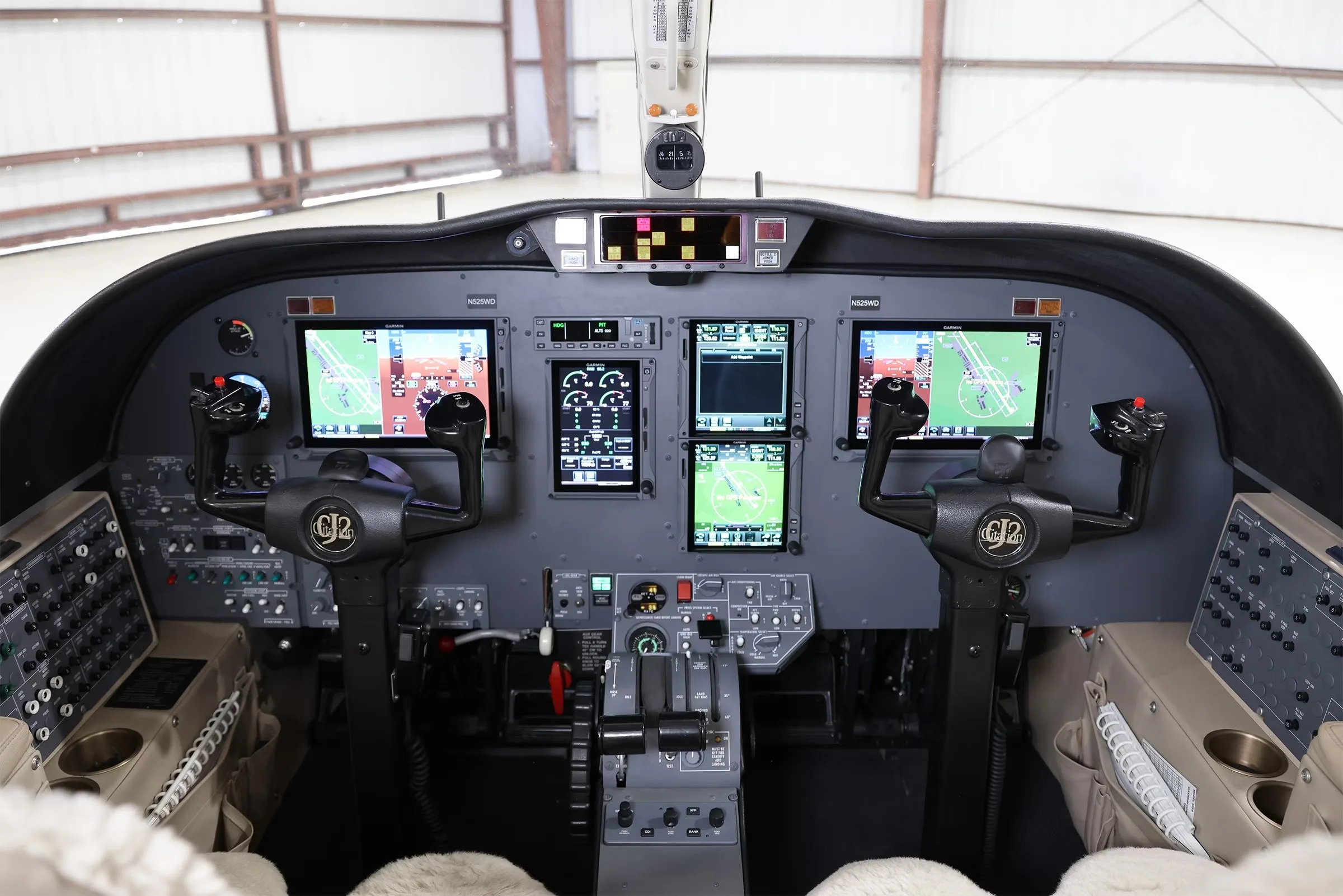 The modern glass cockpit of the Cessna Citation CJ2+ (N525WD) with multiple display screens.