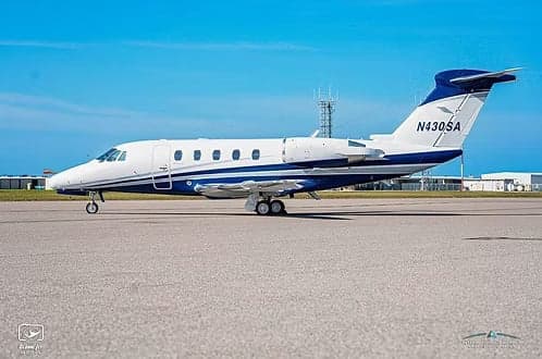A Cessna Citation CJ3+ aircraft with registration N430SA parked on the tarmac.