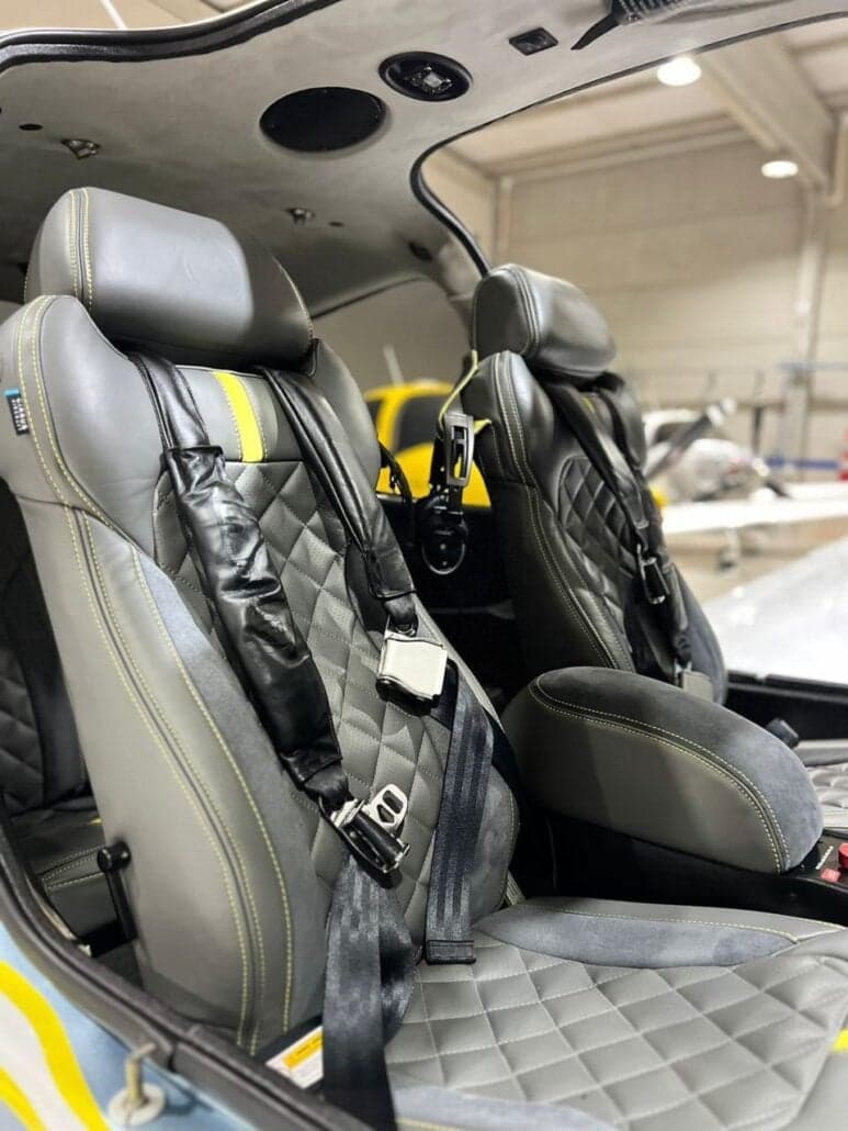 View of the aircraft's front seats with yellow accents.