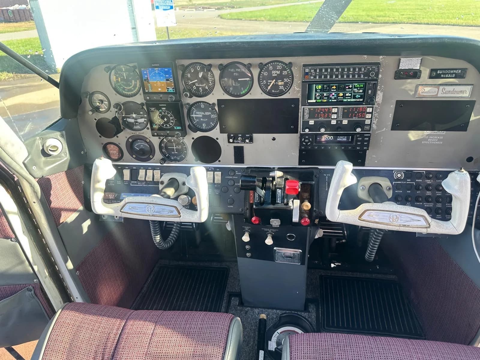 Detailed view of the aircraft's cockpit, showing the instrument panel, yokes, and controls.