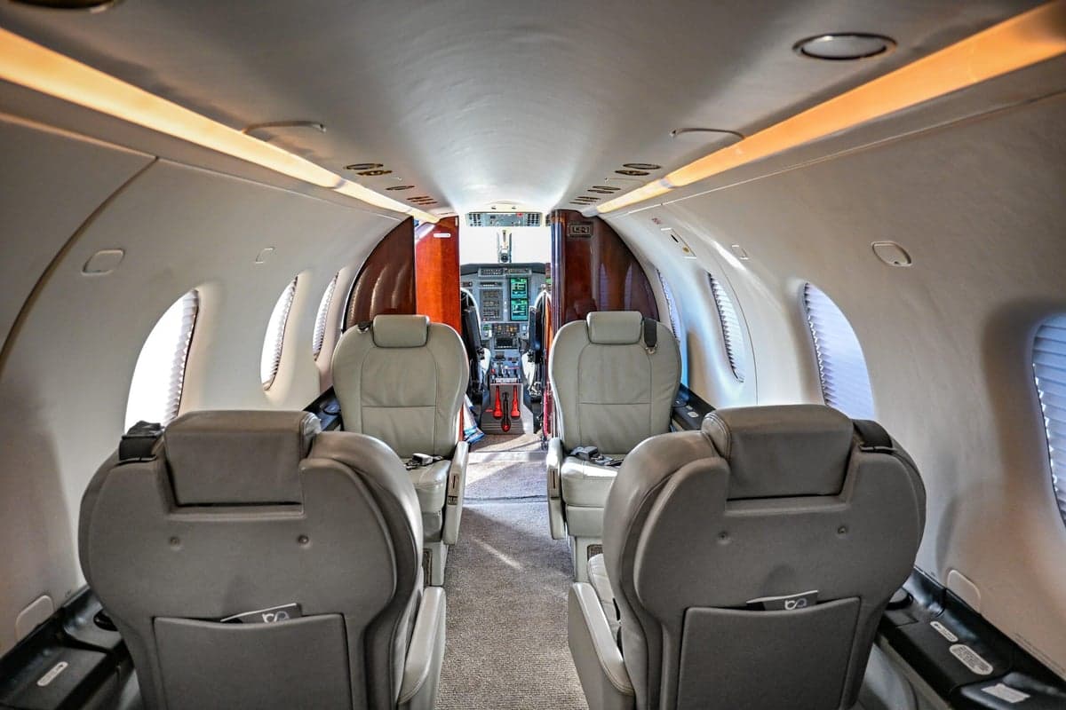Interior view of the Pilatus PC-12 cabin, showing the seating arrangement and cabin layout.