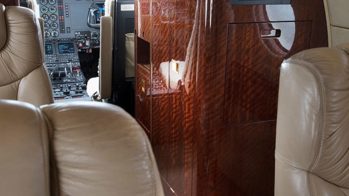 View of the aircraft's interior, showing the seating arrangement and cockpit.