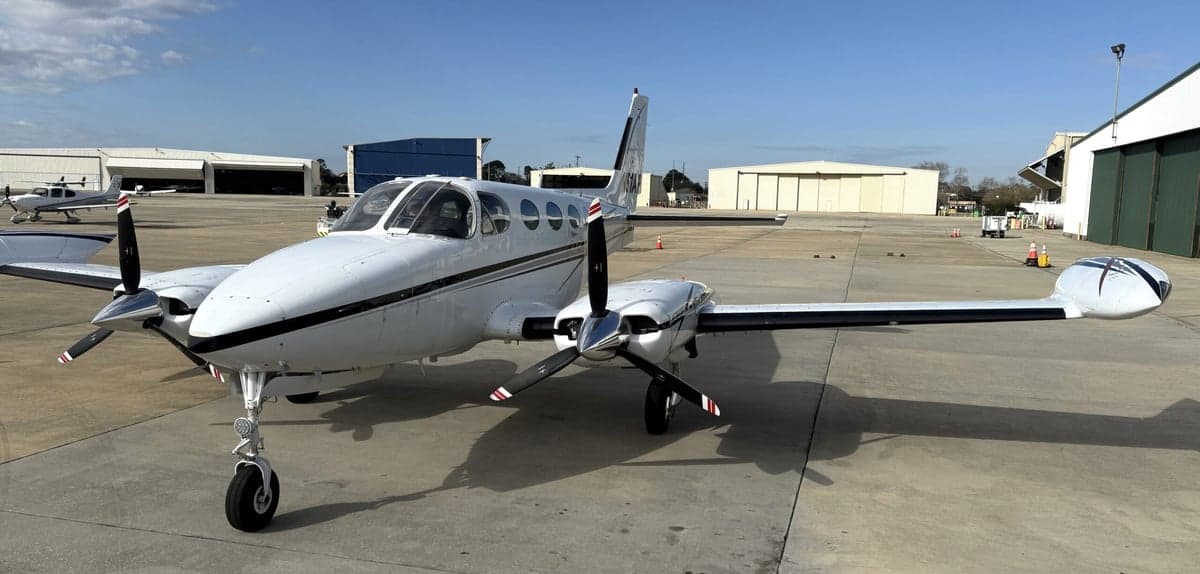 Front view of the Cessna 340A aircraft with registration N51AP parked on the tarmac.