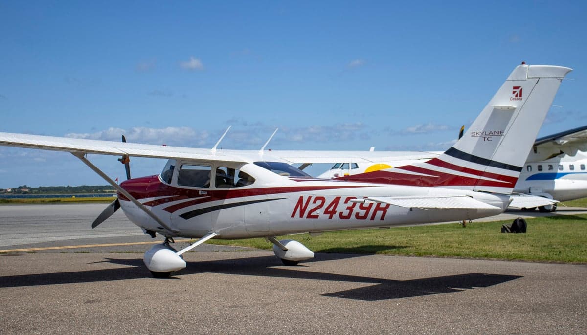 A Cessna Skylane TC, registration N2439R, parked on the tarmac with a red and white paint scheme.