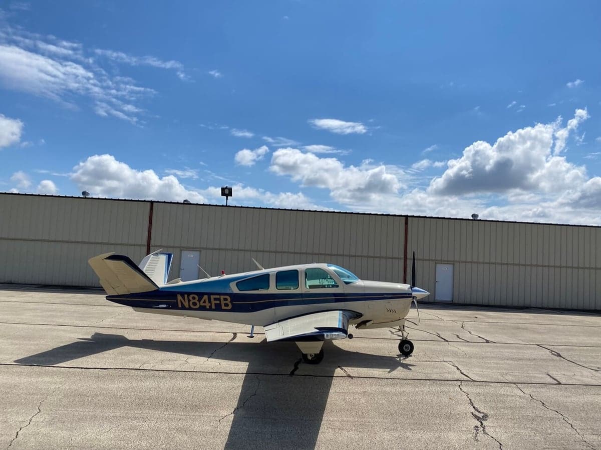 A Beechcraft Bonanza N84FB parked on the tarmac.