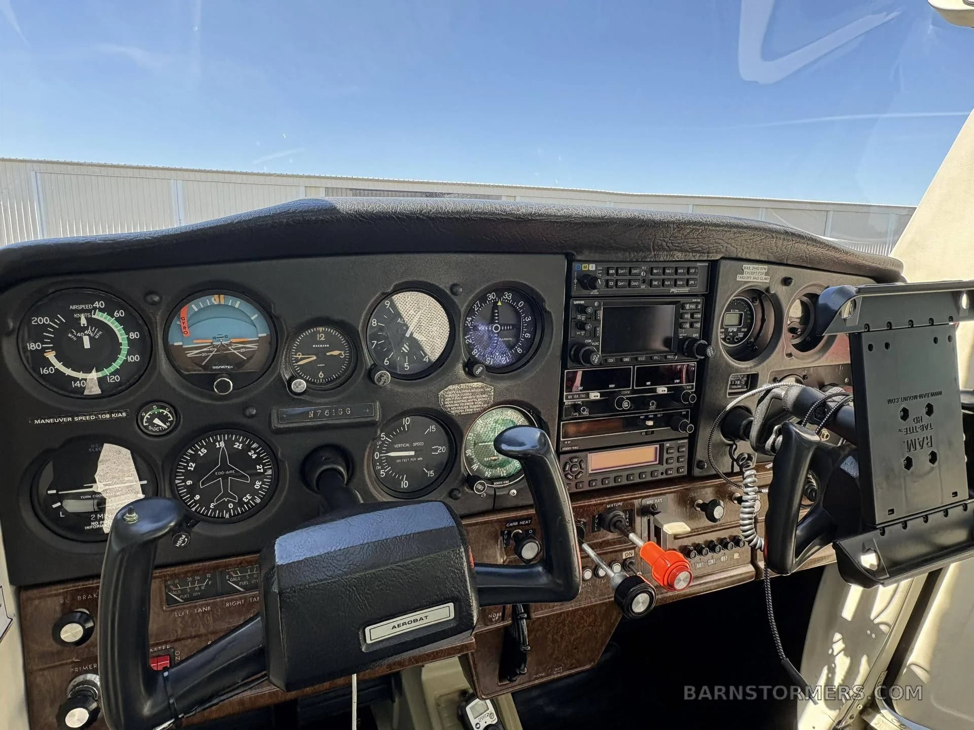 The instrument panel and controls of a Cessna 150 Aerobat, showing various gauges and avionics.