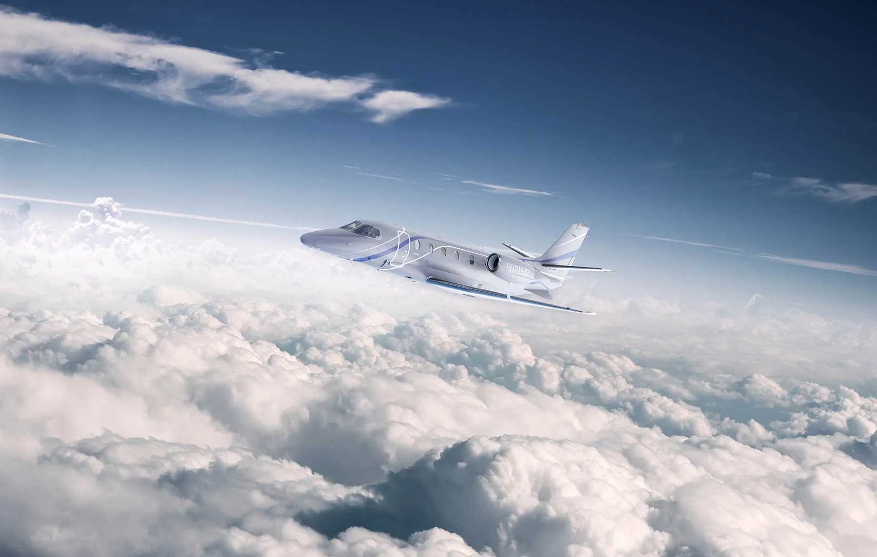 A Citation CJ3 flying above the clouds.