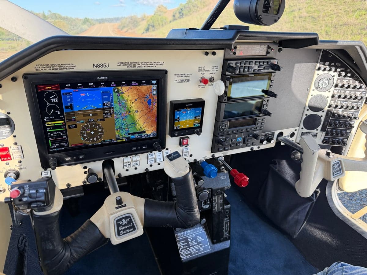 Full view of the Mooney M20J cockpit, showing the instrument panel and control yoke.